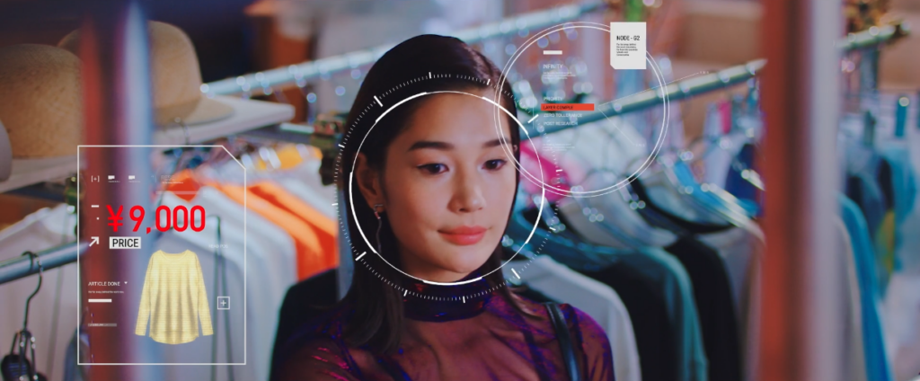 A woman shopping amongst racks of clothes, with a futuristic overlay analyzing her behavior